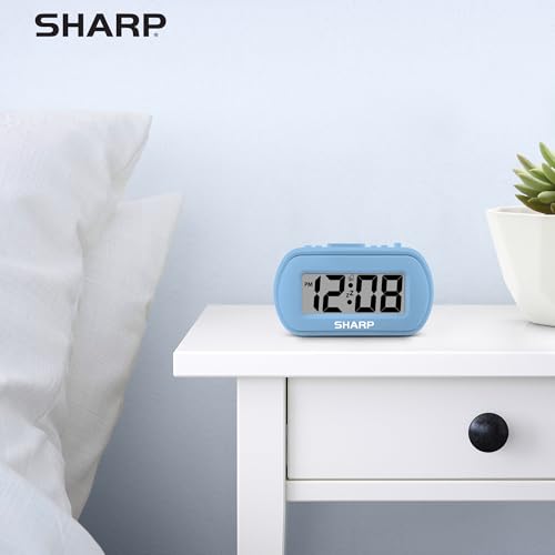 Sharp Battery Alarm Clock with Soft-Touch Case and Backlight, Light Blue | Soft-touch rubberized case; Battery operated; Blue backlight on demand; Ascending alarm; Snooze; Easy to use - color: Blue