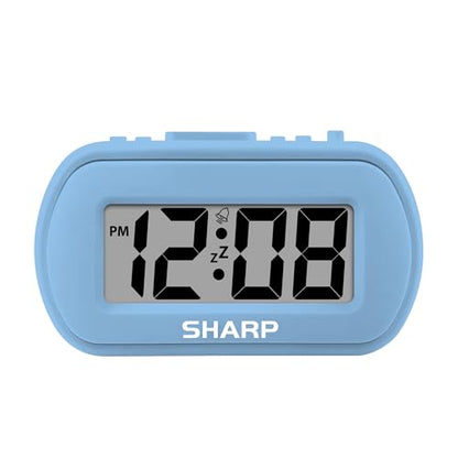 Sharp Battery Alarm Clock with Soft-Touch Case and Backlight, Light Blue | Soft-touch rubberized case; Battery operated; Blue backlight on demand; Ascending alarm; Snooze; Easy to use - color: Blue
