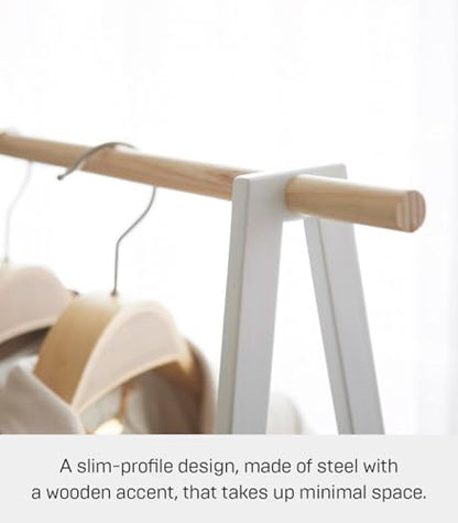 YAMAZAKI Home Freestanding Coat Hanger Clothes Rack with Shelf Steel One Size White | Freestanding coat hanger features a steel frame and bottom shelf. Space-saving vertical organization. Easy to assemble. - color: White