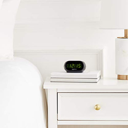 Amazon Basics Small Digital Oval Alarm Clock with LED Display, Nightlight, Snooze Function & Battery Backup, Black, 4.5 x 3.5 x 2.4 Inches