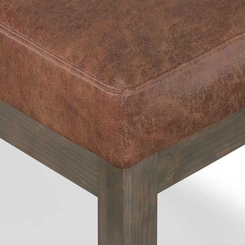 SIMPLIHOME Milltown 27" Wide Vegan Leather Ottoman in Saddle Brown | Distressed saddle brown, contemporary ottoman with a cushioned seat for bedroom seating; rectangle footstool or pouf. - color: Distressed Saddle Brown, style: Small Ottoman Bench
