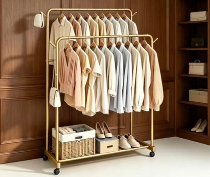 AT-VALY Double Rods Clothes Rack, Sturdy Metal Garment Rack with Wheels, Portable Wardrobe Rack with Bottom Shelf & Side Hooks, Heavy Duty Coat Hanger Stand for Bedroom, Laundry, Living Room,Gold