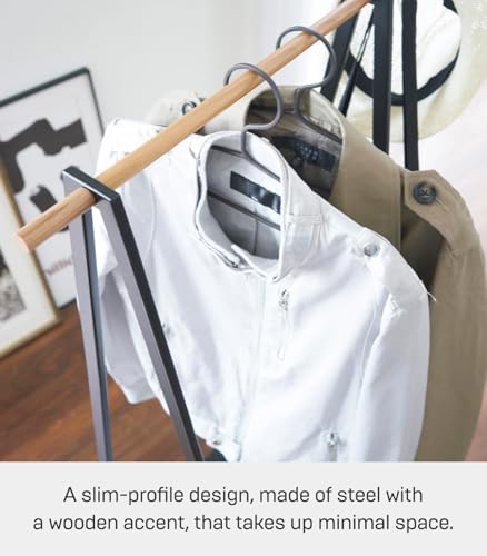 YAMAZAKI Home Tower Freestanding Coat Hanger Clothes Rack With Shelf, 55" - Steel | Freestanding coat hanger features a steel frame and bottom shelf. Space-saving vertical organization. Easy to assemble. - color: Black