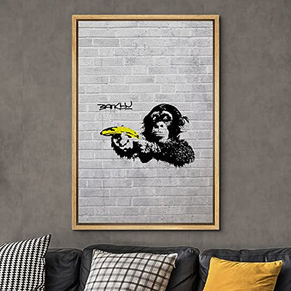 wall26 Framed Canvas Print Wall Art Banksy British Artist Spray Paint Monkey Banana Gun Graffiti & Street Art Urban Illustrations Modern Art Scenic for Living Room, Bedroom, Office - 16"x24" Natural - color: A12-2204-eva25, size: 24"L x 16"W