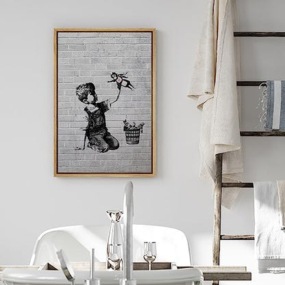 wall26 Framed Canvas Print Wall Art Banksy British Artist Spray Paint Kid Superhero Nurse Toy Graffiti & Street Art Urban Illustrations Modern Art for Living Room, Bedroom, Office - 16"x24" Natural - color: A12-2204-eva26, size: 24"L x 16"W