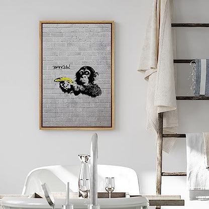 wall26 Framed Canvas Print Wall Art Banksy British Artist Spray Paint Monkey Banana Gun Graffiti & Street Art Urban Illustrations Modern Art Scenic for Living Room, Bedroom, Office - 16"x24" Natural - color: A12-2204-eva25, size: 24"L x 16"W