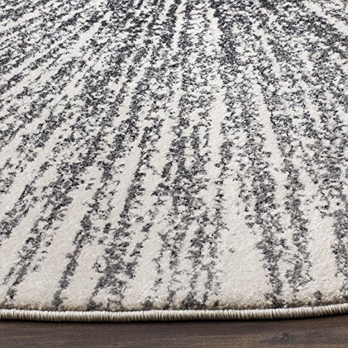 SAFAVIEH Evoke Collection Area Rug - 5'3" Round, Black & Ivory, Abstract Burst Design, Non-Shedding & Easy Care, Ideal for High Traffic Areas in Living Room, Bedroom (EVK228K)